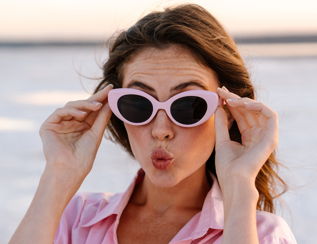 Woman wearing sunglasses outside.